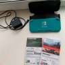 Nintendo Switch Lite + case + 2 games