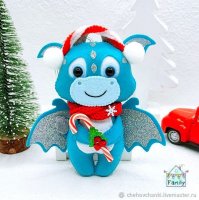 Turquoise dragon with a Candy Plush Toy